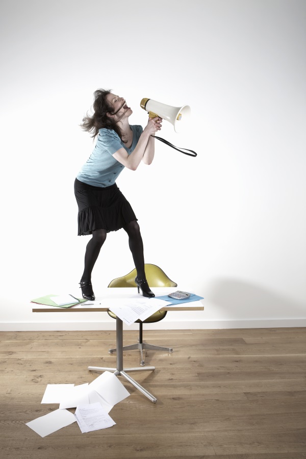 woman shouting into megaphone