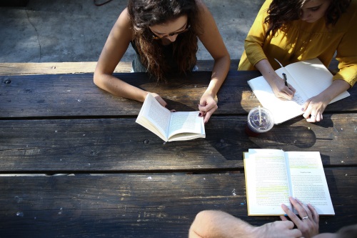 3 women in a writers group at a table