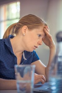 woman staring at computer