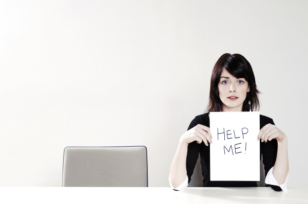 woman holding help me sign