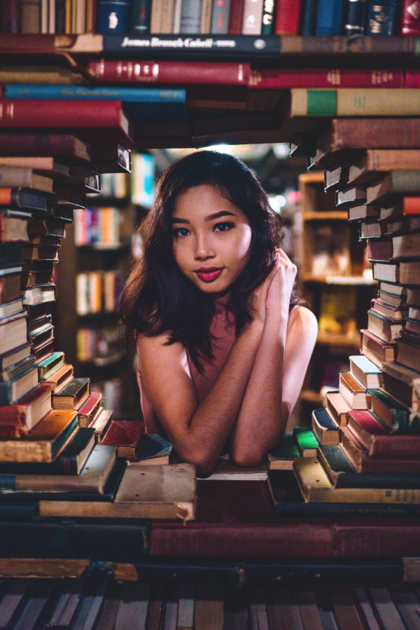 woman surrounded by books
