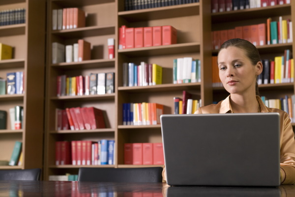 Will writing a book make you rich? woman in library