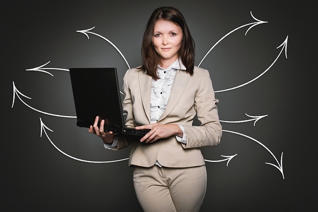 woman holding laptop