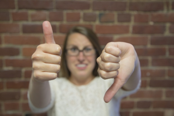 Image of beta reader with thumbs up and down