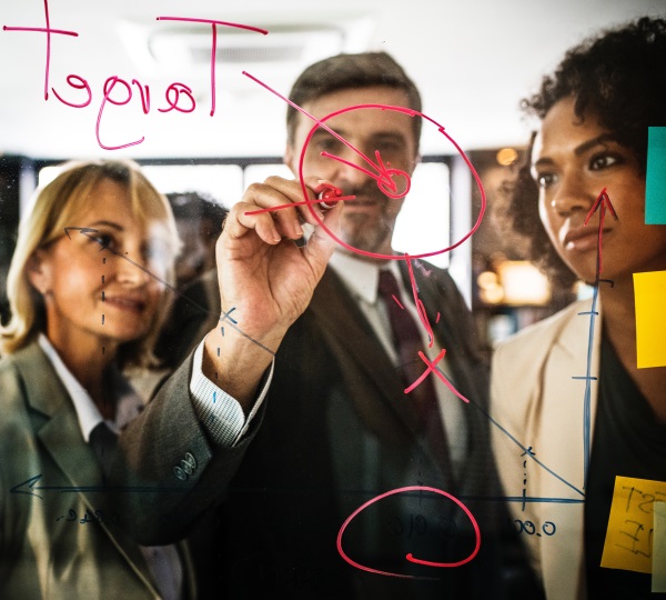 team drawing on glass