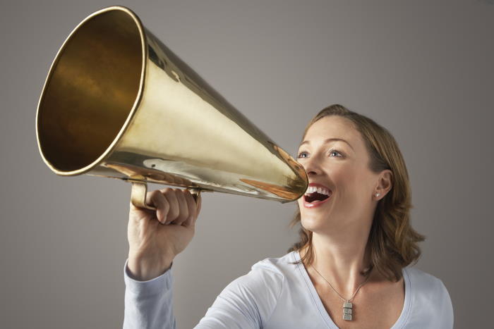 woman with megaphone using her voice
