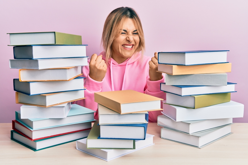 woman with pile of books