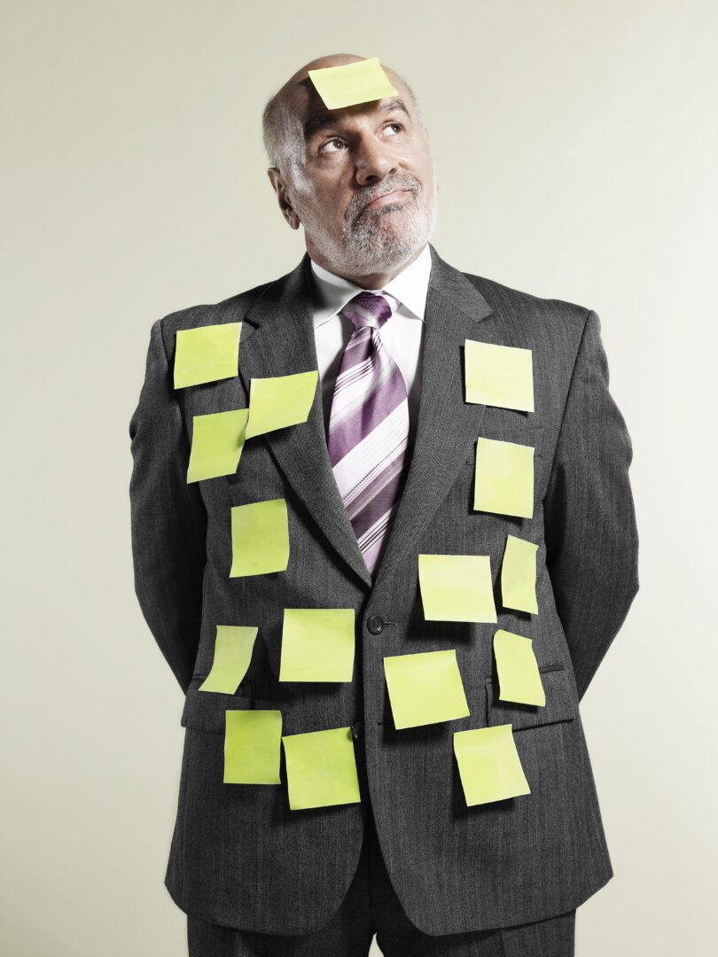 man with post it notes on him